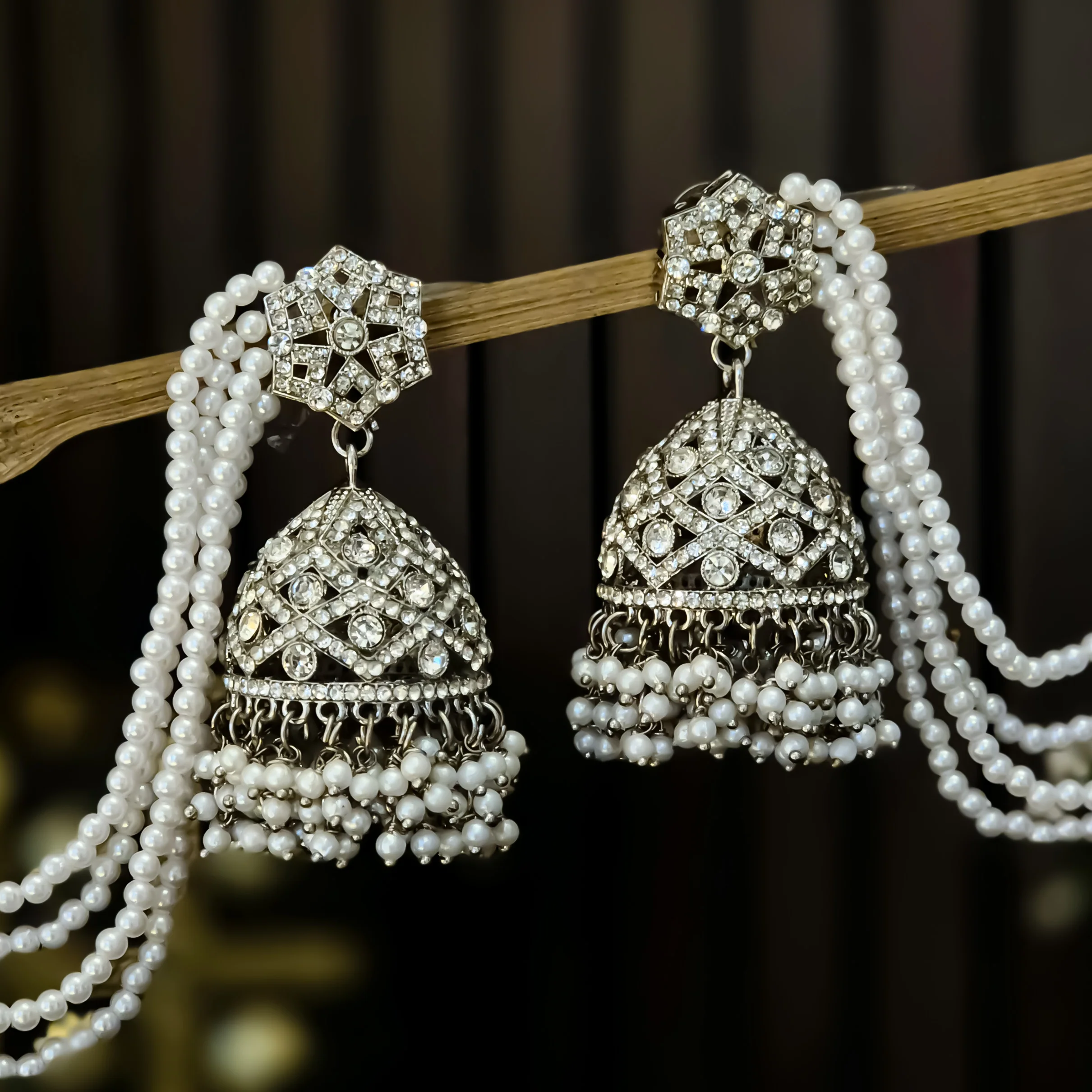 Rihana Rhodium Reverse AD Jhumka Earrings with Earchain - Silver - Image 3